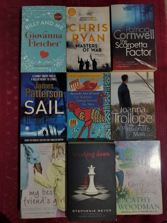 Collection of books with various covers on a red background

